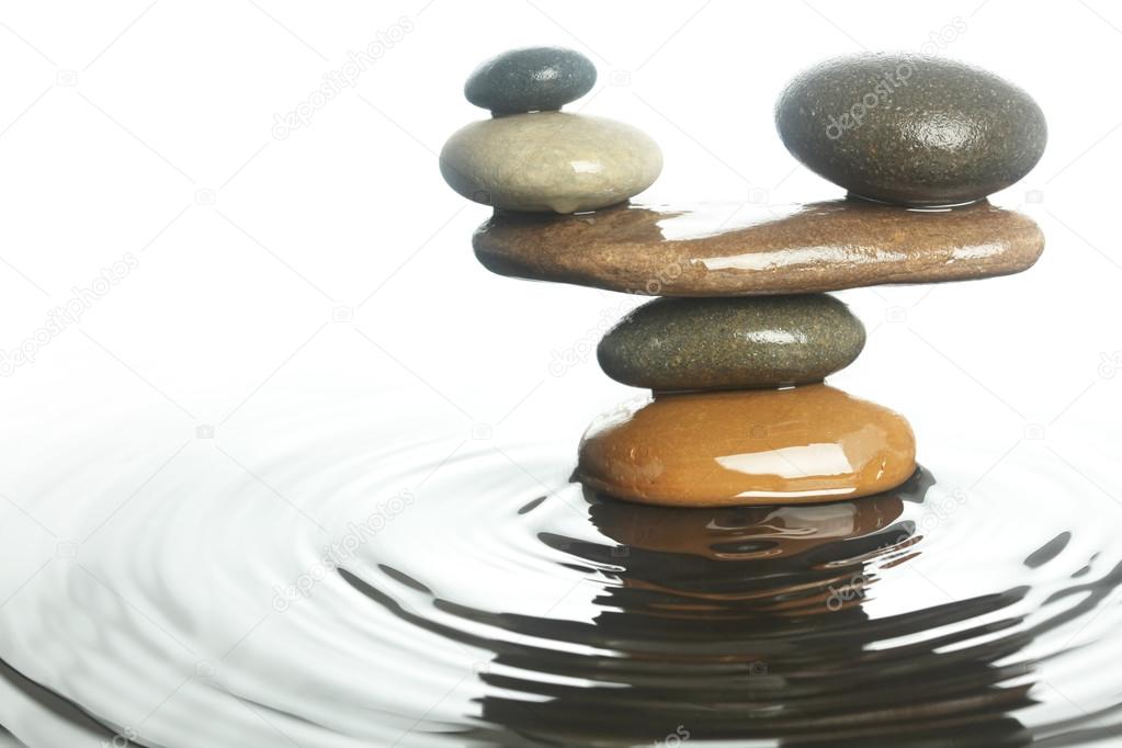 Carefully balanced stones in water