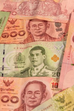 Tayland bahtından bir kompozisyon. THB banknotları, konuların iş, bankacılık, medya vb olarak resmedilmesi için büyük seçenekler sunmaktadır.