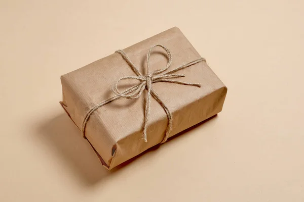 Ready Made Wrapped Kraft Paper Gift Beige Background Eco Box — Stock Photo, Image