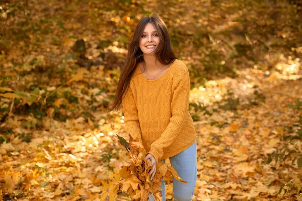 Playful Young Woman Yellow Sweater Throwing Autumn Leaves Laughing Colorful — Stock Photo, Image