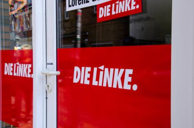 Flensburg, Germany - September 04, 2021: Die Linke logo on the door. The Left (German: Die Linke) commonly referred to as the Left Party, is a democratic socialist political party in Germany. clipart