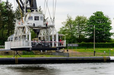 Rendsburg, Germany - May 11, 2022: Rendsburg Transporter Bridge (Schwebefaehre). The hanging ferry under the bridge span .