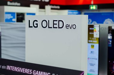 Hamm, Germany - August 20, 2021: LG OLED evo signboard in the shop.