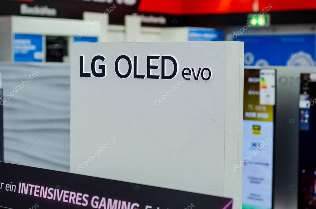 Hamm, Germany - August 20, 2021: LG OLED evo signboard in the shop.