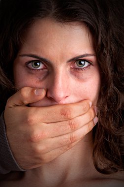 Woman Silenced by Aggressive Husband clipart