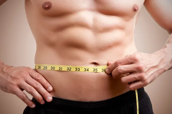 Fit Man Measuring His Waist — Stock Photo, Image