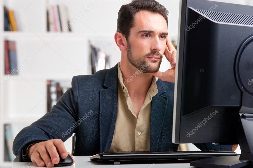 Man Looking At A Computer Monitor