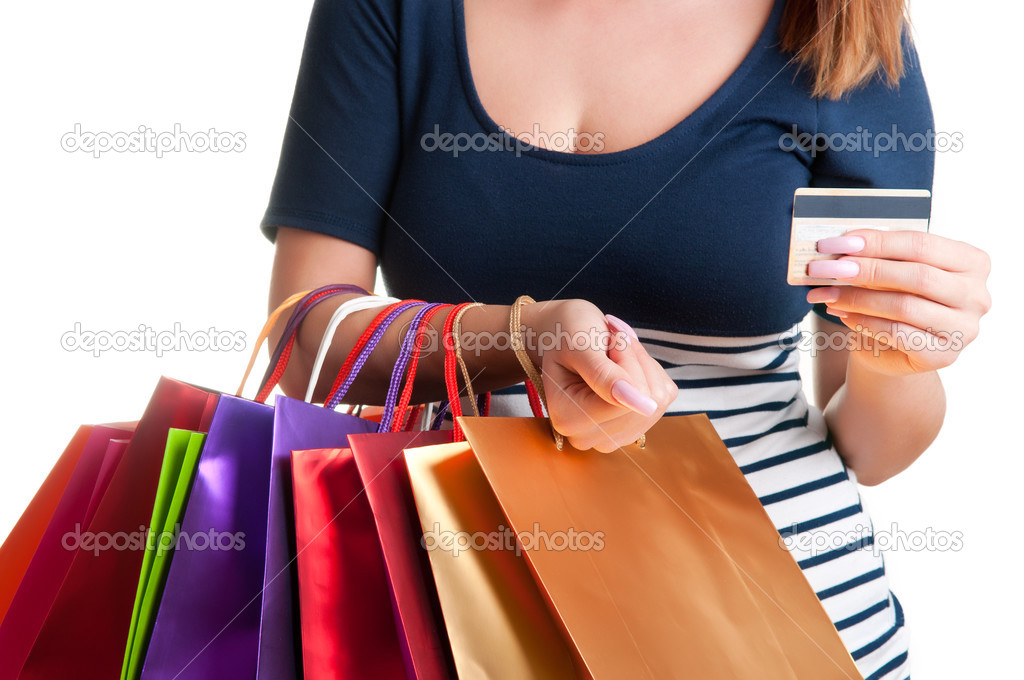 Woman Carrying Shopping Bags And Holding a Credit Card