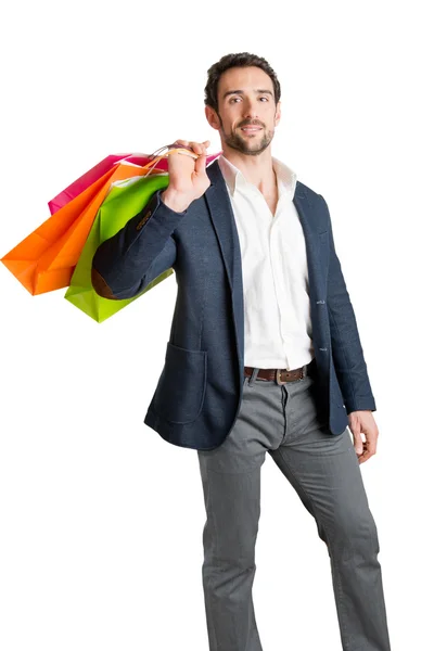 Mann trägt Einkaufstüten — Stockfoto