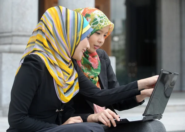 Two Scarf girl use laptop — Stok fotoğraf