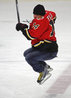 NHL Hockey Theo Fleury Jumps Skating clipart