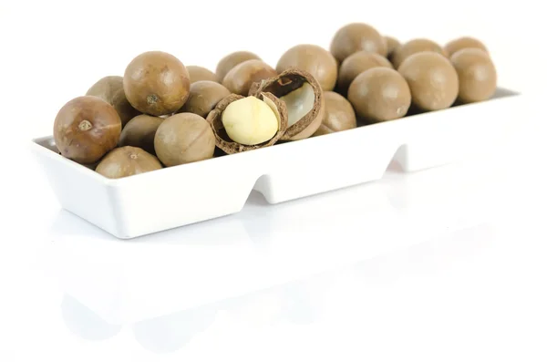 Macadamia en tazón blanco — Foto de Stock