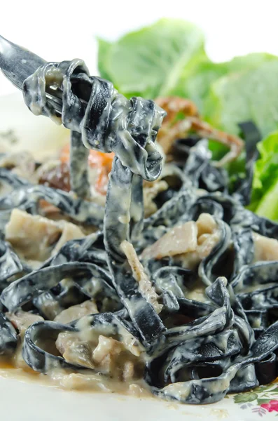 Black pasta on fork — Stock Photo, Image