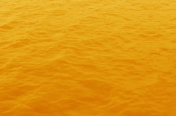 Yellow water surface — Stock Photo, Image