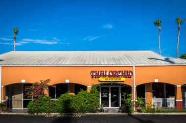 Grand Cayman, Cayman Islands, Aug 2022, view of the Thai Orchid restaurant at Queen's Court Plaza in the George Town district