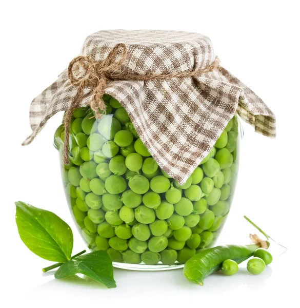 Green peas in glass jar — Stock Photo, Image