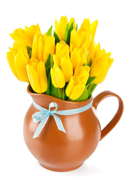 Yellow tulips flowers in jug — Stock Photo, Image