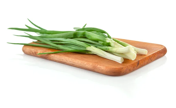 Fresh green onion on wooden board — Stock Photo, Image