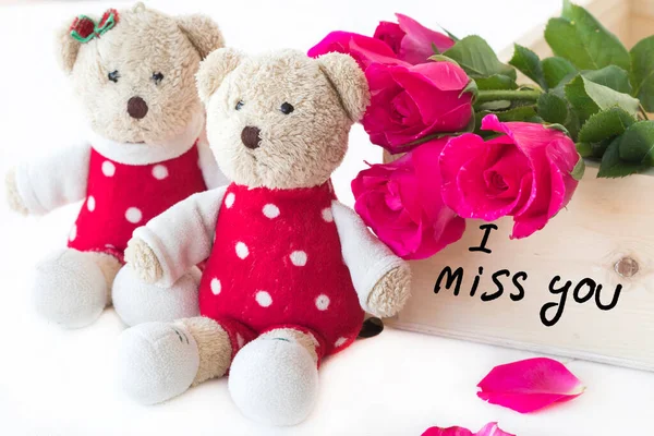 i miss you message card handwriting with couple teddy bears, red rose flowers arrangement postcard style on background white