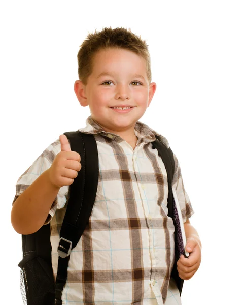 Feliz colegial vistiendo mochila y dando pulgares hacia arriba aislado en blanco — Foto de Stock