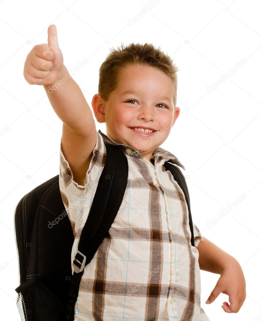 Happy schoolboy wearing backpack and giving thumbs up isolated on white