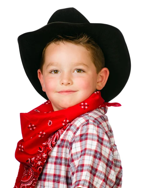 Criança vestida de cowboy brincando isolada em branco — Fotografia de Stock