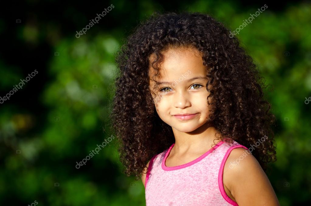 Outdoor portrait of pretty mixed race African-American 