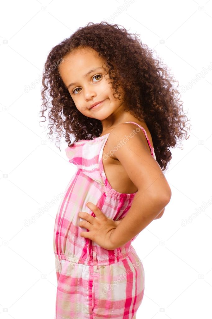 Portrait of pretty African-American mixed race child against white background