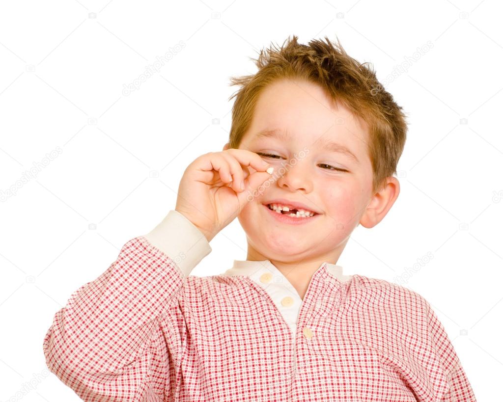 Child checking out his lost tooth isolated on white