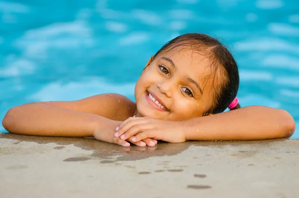 Portrait of happy pretty mixed race child by side of pool during summer — Stock Photo, Image