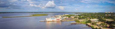 Biloxi, Mississippi back bay with casinos and other buildings in panoramic image clipart