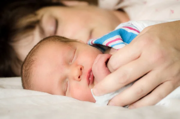 Newborn infant child resting next to mother after delivery at hospital — Stock Photo, Image