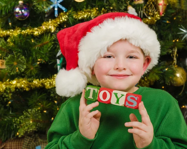 Christmas portrait of happy child wearing Santa hat — Stock Photo, Image