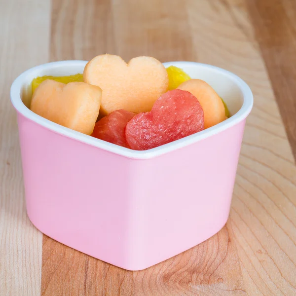 Valentines Day child friendly healthy treat with heart-shaped fruit cantaloupe, watermelon and pineapple — Stock Photo, Image