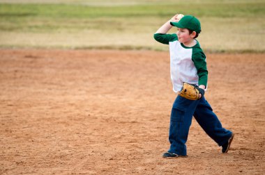 Boy throws baseball during practice clipart