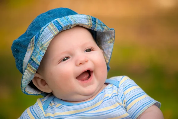 Outdoor portrait of happy smiling infant baby boy Royalty Free Stock Photos