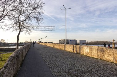 SVILENGRAD, BULGARIA - DECEMBER 31, 2021: Sunset view of Sixteenth century Mustafa Pasha Bridge (Old Bridge) over Maritsa river in town of Svilengrad, Haskovo Region, Bulgaria