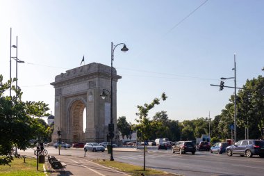 BUCHAREST, ROMANIA - AUGUST 17, 2021:  Sunset view of Arch of Triumph in city of Bucharest, Romania