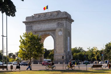 BUCHAREST, ROMANIA - AUGUST 17, 2021:  Sunset view of Arch of Triumph in city of Bucharest, Romania
