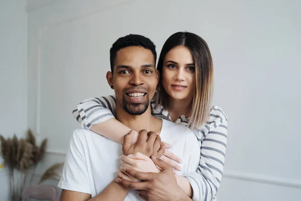 Beautiful mixed race couple portrait at home — Stock Photo, Image