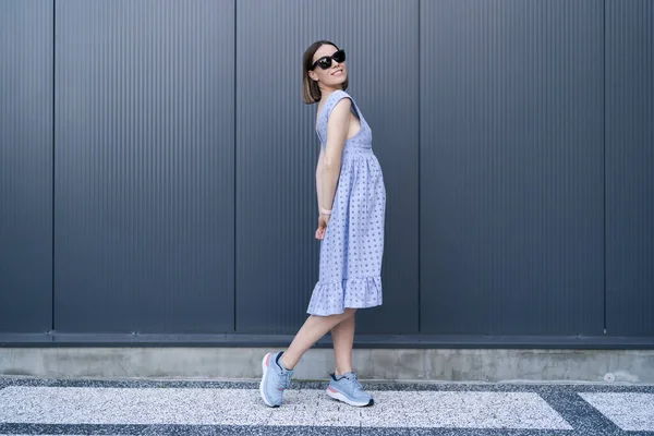 Young Caucasian Woman Posing Blue Dress Gray Wall Background Outdoors — Stock Fotó