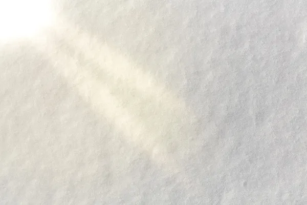 Vit snö ytan med solstrålarna — Stockfoto