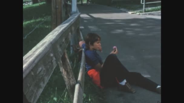 Lugano Switzerland June 1968 Boy Sitting Side Road – stockvideo