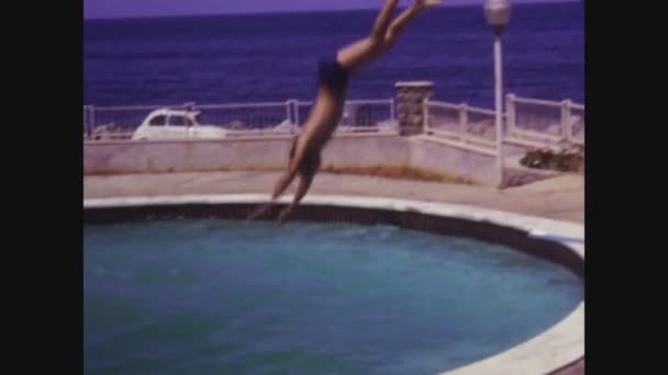 Piano Battaglia Italy July 1971 Boys Jump Pool Diving Board — Stock Video