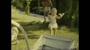 Paris, France july 1958: Babies summer family memories outdoor garden in 50s