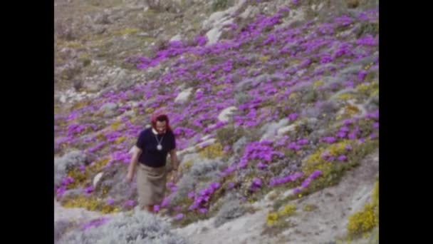 Nuoro Italy June 1966 Woman Walks Flower Field 60S — Stock Video