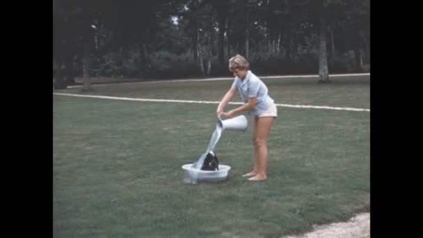 Normandy France May 1964 Girl Bathes Dog Garden Scene 60S — Vídeo de Stock