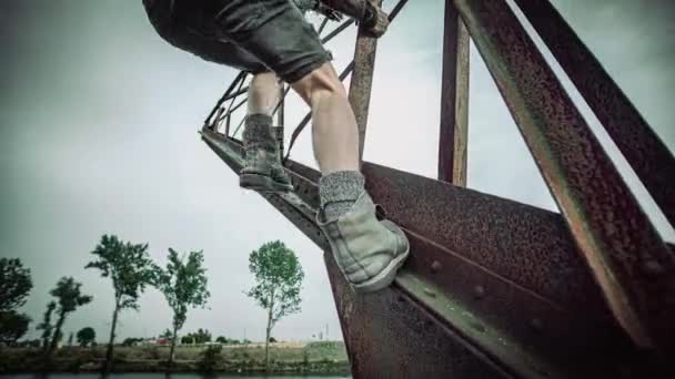 Man Tattooed Body Climbs Old Rustic Crane Walks End Sit — 비디오