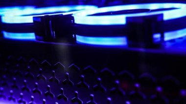 rgb fan in pc case. Rainbow ropeller for cooling computer components. Gaming pc glows in the dark 4k - The system unit of a modern gaming computer. Coolers with LED backlight
