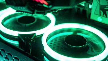 rgb fan in pc case. Rainbow ropeller for cooling computer components. Gaming pc glows in the dark 4k - The system unit of a modern gaming computer. Coolers with LED backlight